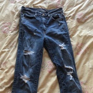 American Eagle Darker washed ripped jeans.